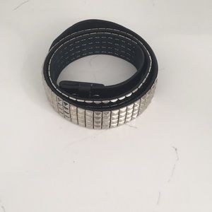 Black and silver customizable belt.
